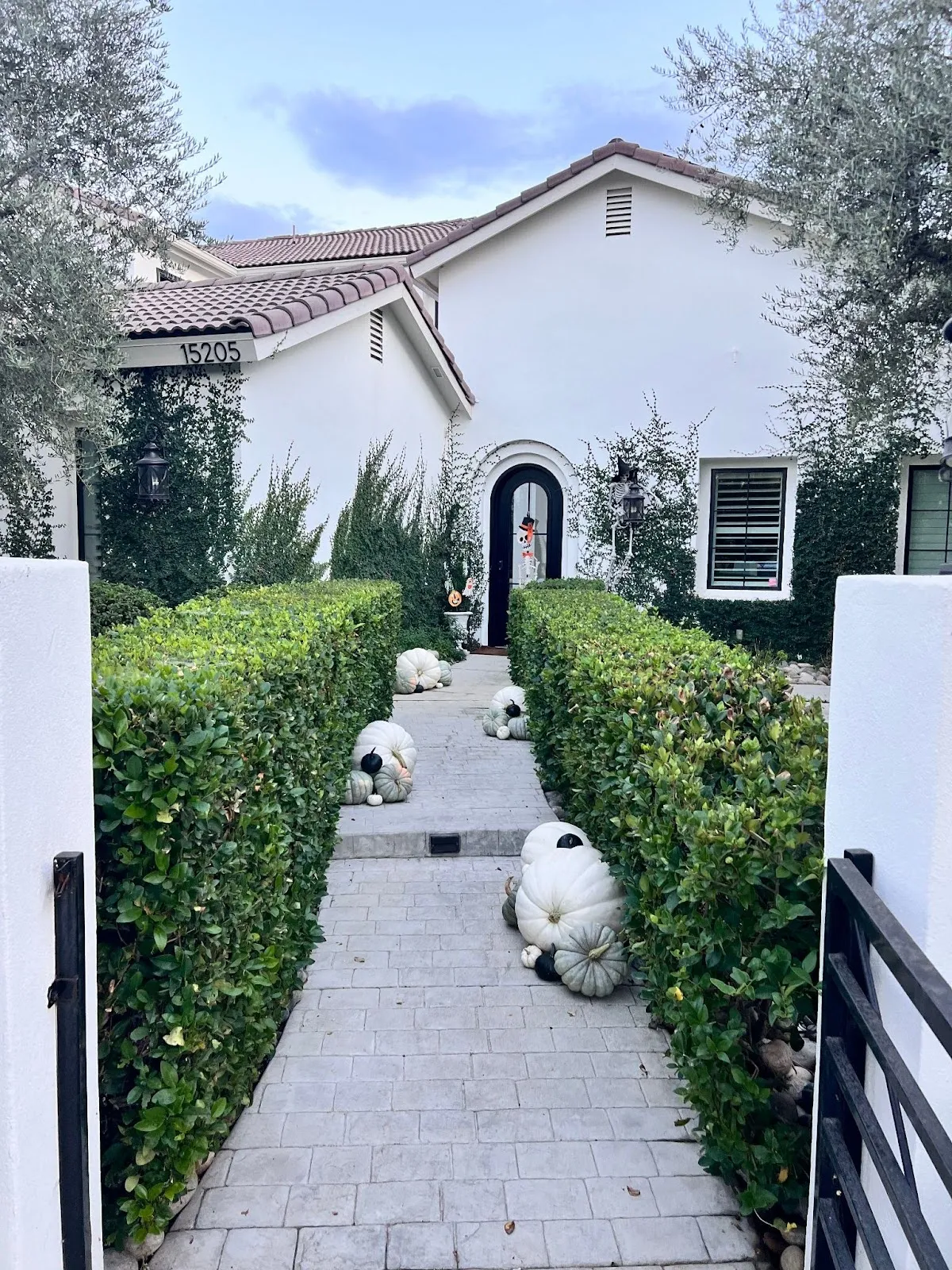 Pumpkins lining a customer's porch steps